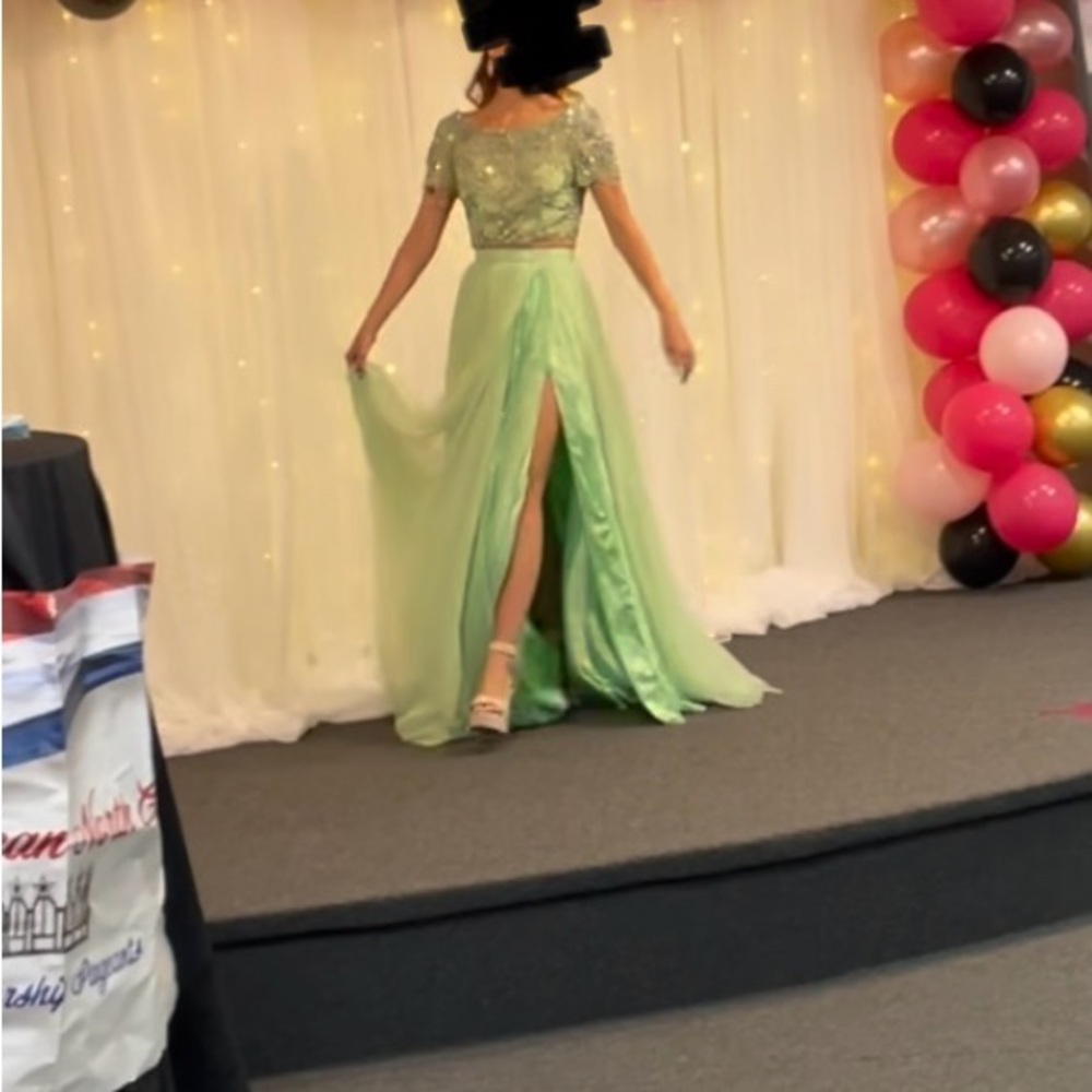 Green two piece dress. Altered to create a leg slit.